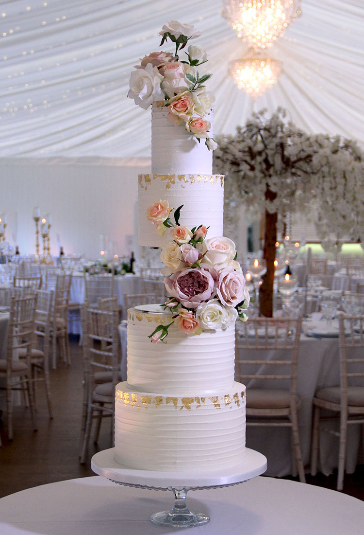 Side Floating Wedding Cake with Ripple Finish & Pastel Flowers