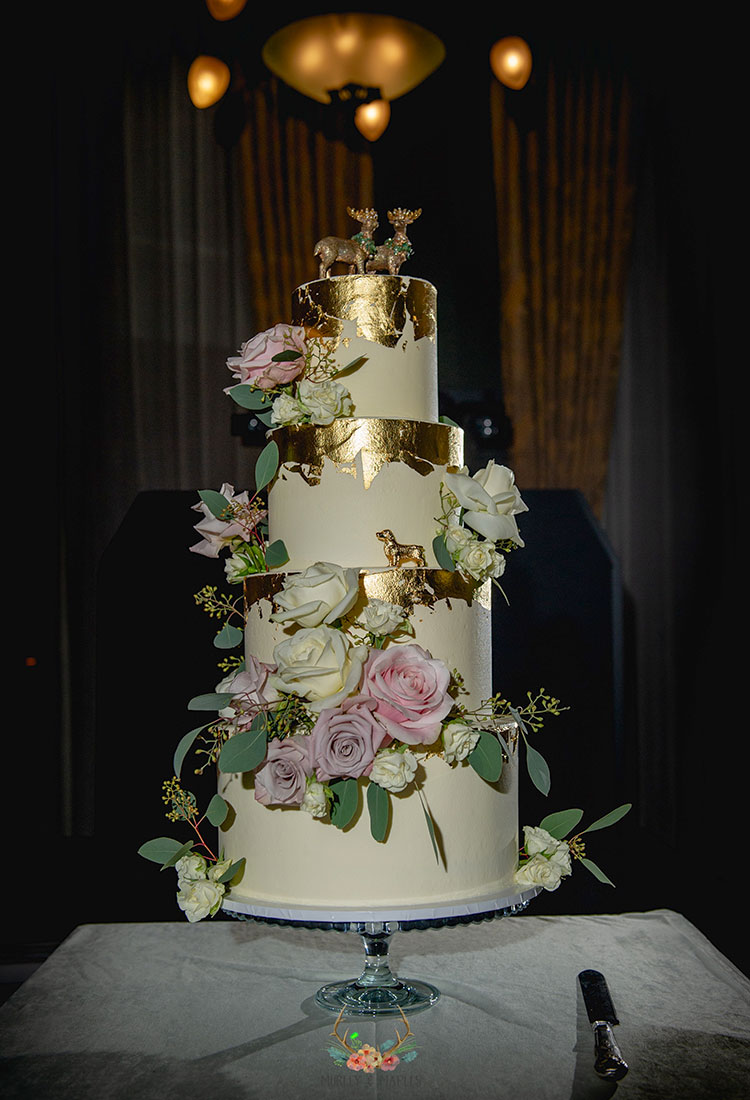 White Wedding Cake with Gold Rims & Pastel Flowers