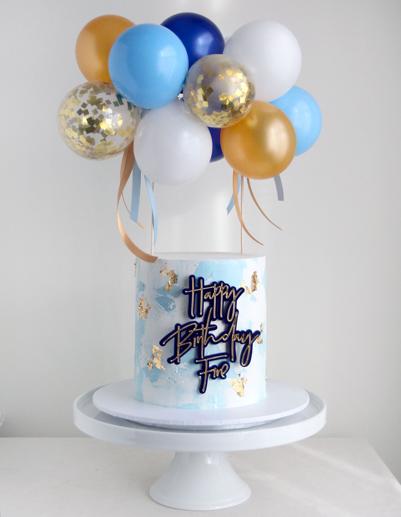 Blue Celebration Cake with Blue & Gold Balloons